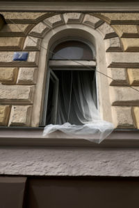 Europe, Czech Republic, Prague, house facade, detail, open window, curtain Europe, Czech Republic, Prague, house facade, detail, open window, curtain